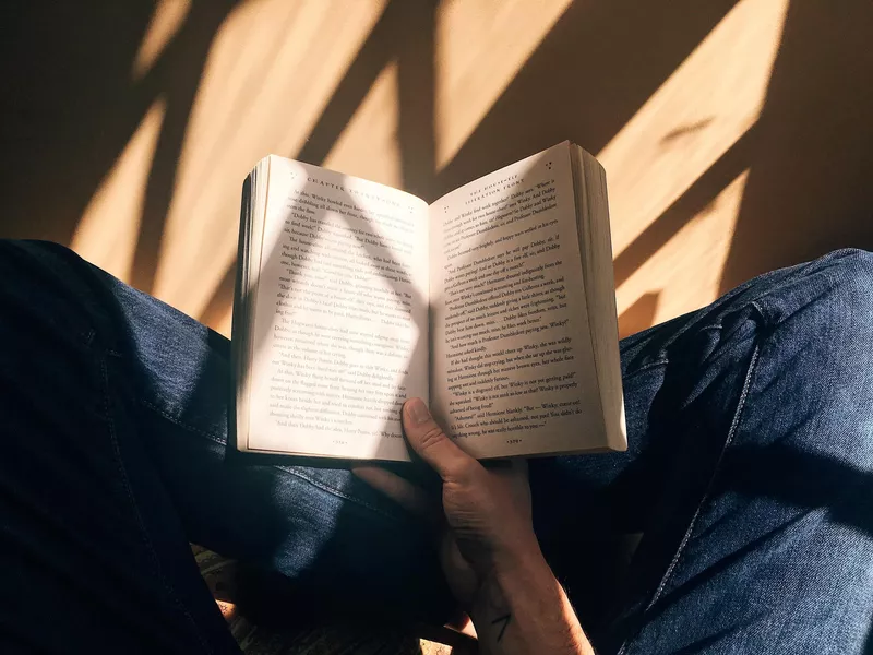 Young student reading a book